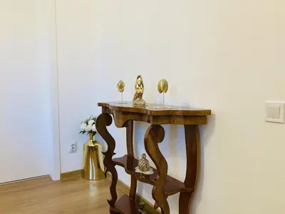 a wooden table with figurines on it in a room at Bright & Cozy Apartment for 4 Guests in Plovdiv Centre in Plovdiv