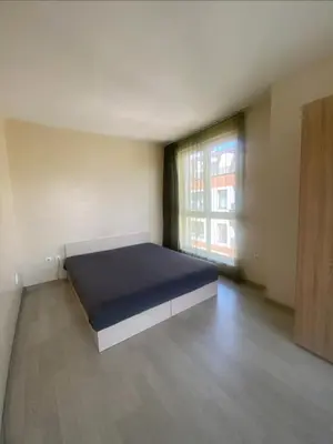 a bedroom with a bed in a room with a window at Student City Vitosha View Apartment in Sofia