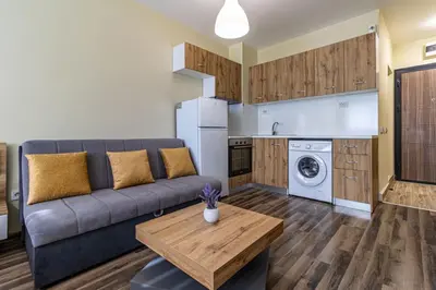 a living room with a couch and a table at 20th Residence Studio in Sofia