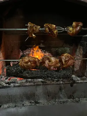 a bunch of meat cooking on a grill at Спа Комплекс Ливадите in Deredzhik-Kʼoy