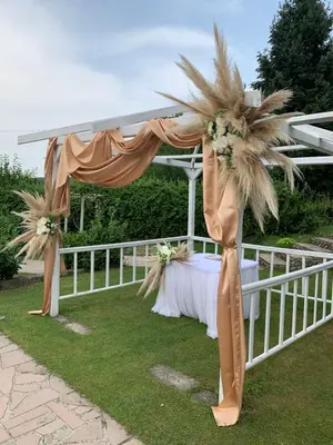 a tent with a table and a palm tree at Спа Комплекс Ливадите in Deredzhik-Kʼoy