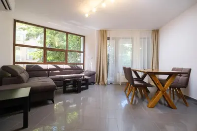 a living room with a couch and a table at 2-Bedroom Apartment in the City Center in Plovdiv