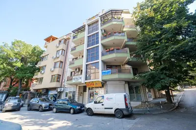 a white van parked in front of a building at 2-Bedroom Apartment in the City Center in Plovdiv