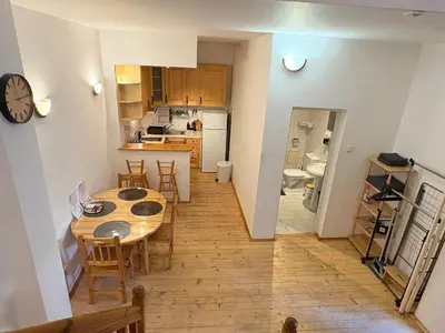 a kitchen and dining room with a table and a dining room at Charming Loft Sofia Center in Sofia
