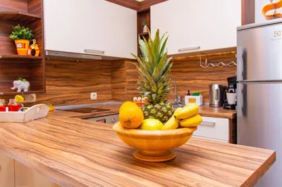 a bowl of fruit sitting on top of a kitchen counter at Domus Apartment Amber with Parking in Plovdiv