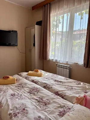 two beds sitting next to each other in a bedroom at Apartment Hristina in Dobrinishte