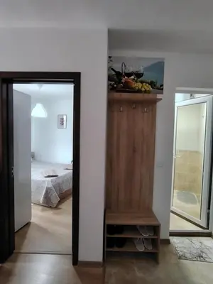a bedroom with a bed and a mirror and a dresser at Apartament Khan Kubrat in Sandanski