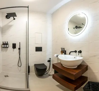a bathroom with a sink and a shower at Einik Luxury Apartments in Velingrad