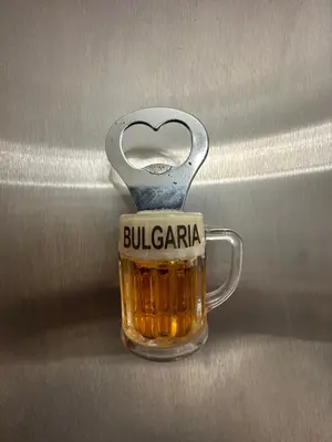 a glass mug of beer in a door latch at Apartament Avangard in Pazardzhik