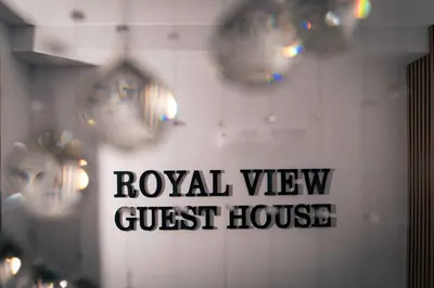 a wall with a sign that says royal view guest house at Royal View Guest House in Dospat