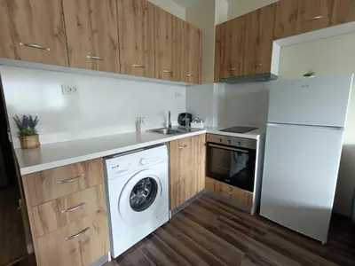 a kitchen with a washer and a dishwasher at 20th Residence Studio 1 in Sofia