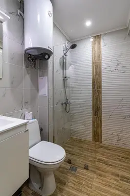 a bathroom with a toilet and a shower at Student City Studio With Mountain View Balcony and Underground Parking 1 in Sofia