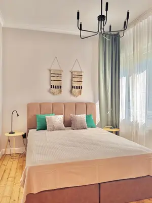 a bedroom with a large bed with green accents at Central Luxury Stay Sofia Center by Top Kvartiri Ltd in Sofia