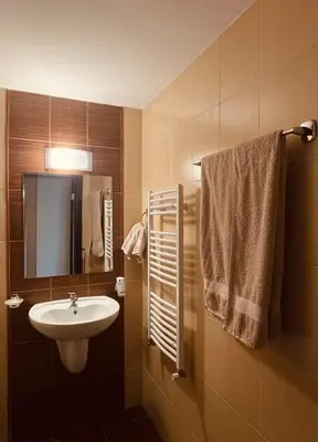 a bathroom with a sink and a mirror at Mountain View Apartment at Bansko Royal Towers in Bansko
