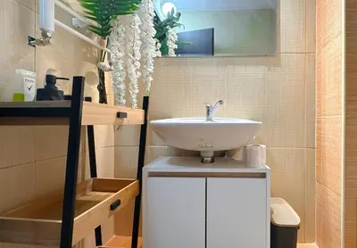 a bathroom with a sink and a tub at BudgetWork-Friendly Apartment near Business Park in Sofia