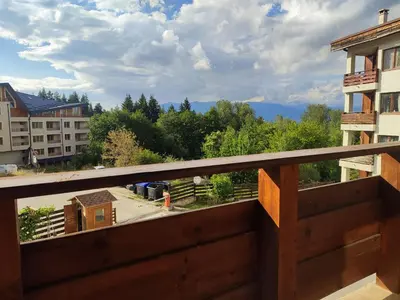 a balcony with a view of the mountains at Deluxe Apartment 