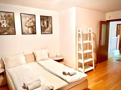 a bedroom with a bed and a book shelf at Wood Fireplace Duplex near Pamporovo - Parking, Sleeps 6 in Smolyan