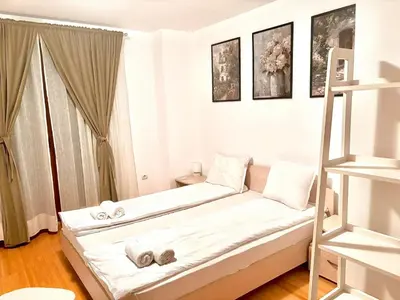 a small white room with a bed and a ladder at Wood Fireplace Duplex near Pamporovo - Parking, Sleeps 6 in Smolyan
