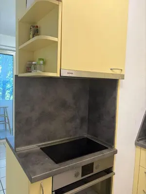 a kitchen with a stove top oven in a kitchen at ApartSofiaMusagenica in Sofia