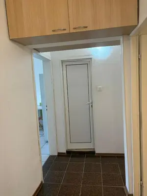 an empty room with a door and a hallway at ApartSofiaMusagenica in Sofia