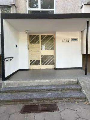 a building with a door and some stairs at ApartSofiaMusagenica in Sofia