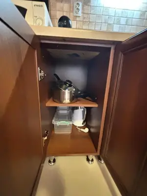 a small cabinet in a kitchen with a pot on it at Cozy One Bedroom Apartment in Bansko Near Gondola with Wi Fi in Bansko