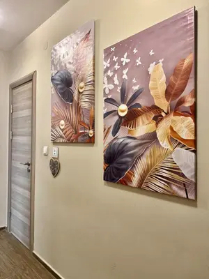 two paintings hanging on a wall in a hallway at City Modern & Cozy Apartment for 4 Guests in Sofia, Lozenets in Sofia