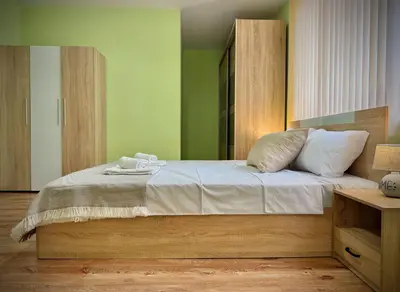 a bedroom with a large bed with white pillows at City Modern & Cozy Apartment for 4 Guests in Sofia, Lozenets in Sofia