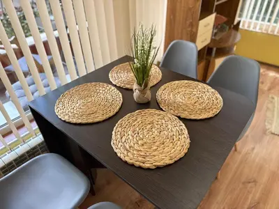 a black table with three straw hats on it at City Modern & Cozy Apartment for 4 Guests in Sofia, Lozenets in Sofia