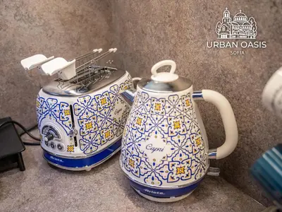 two blue and white vases sitting next to each other at Urban Oasis Sofia in Sofia