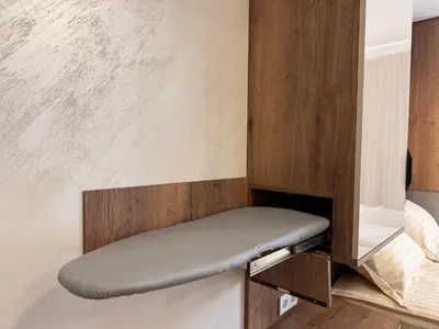 a bench in the corner of a room at Serenity Suites in Gotse Delchev