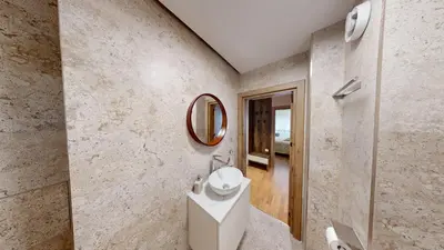 a bathroom with a sink and a mirror at Cozy Central 1BDR Apartment Sofia near Mall Sofia and metro in Sofia