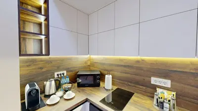 a kitchen with a counter with a sink and a microwave at Cozy Central 1BDR Apartment Sofia near Mall Sofia and metro in Sofia
