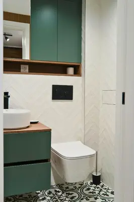 a bathroom with a white toilet and a sink at Quiet & Stylish Apartment in Central Sofia in Sofia