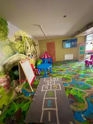 a childrens room with a mural on the wall at Green View Apartment in Chepelare