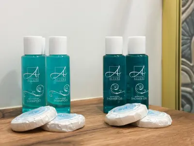 a group of three bottles of soap on a table at Charming Sofia Center Stay for 4 by Flat Mаnager in Sofia