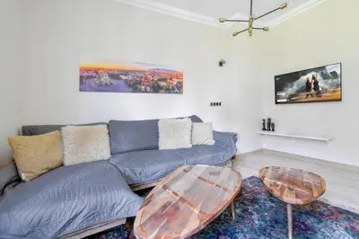 a living room with a couch and a table at Charming Sofia Center Stay for 4 by Flat Mаnager in Sofia
