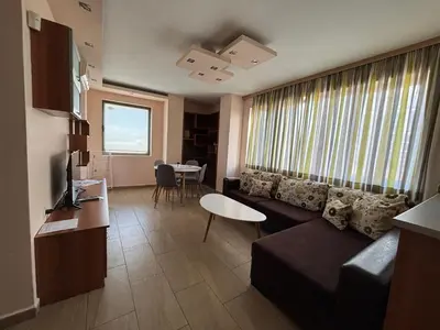 a living room with a couch and a table at Cozy 1-Bedroom Apartment Near Old Town - Purple5 in Plovdiv