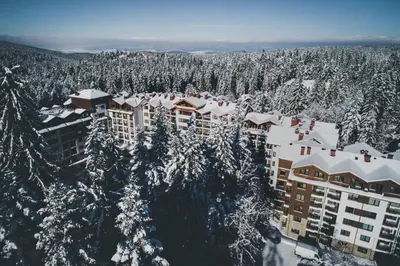 an aerial view of a building covered in snow at Stylish studio E61 in Borovets Gardens in Borovets
