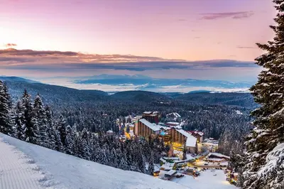 a view of a ski resort in the snow at Stylish studio E61 in Borovets Gardens in Borovets