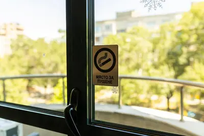 a sign on a window with a sign on it at Megy's 3 Bedroom Central Apartment near NDK in Sofia