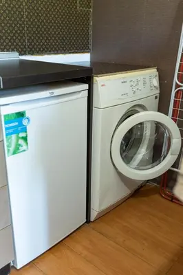 a washing machine and a washer in a kitchen at Megy's Top Central Studio Next to NDK in Sofia