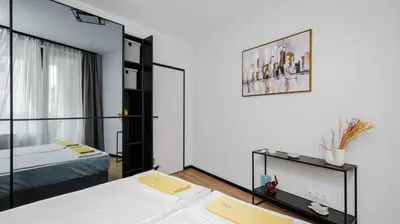 a bedroom with a bed and a mirror at Fresh & Modern Apartment with Balcony by Flat Mаnager in Sofia