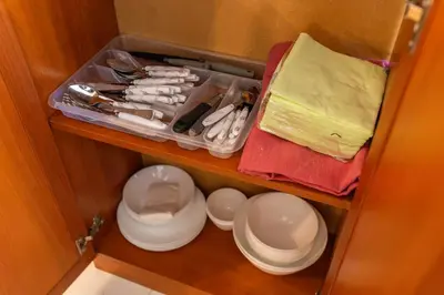 a cupboard with plates and utensils in a room at Megy's 3rd Top Central Room in Sofia