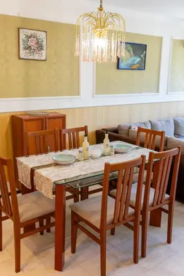 a dining room with a table and chairs at Megy's 2nd Top Central Room in Sofia