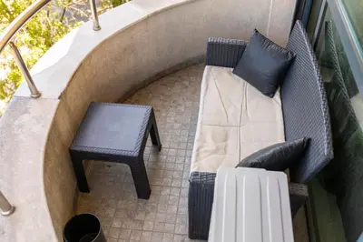 a patio with two chairs and a table at Megy's 1st Room next to the National Palace of Culture in Sofia