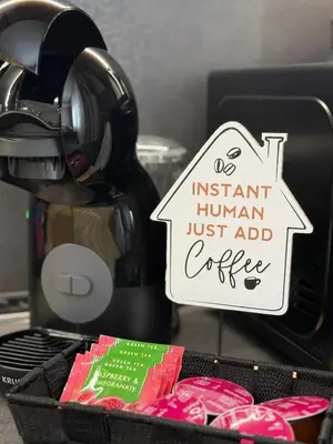 a sign that reads instant human just add coffee at Asen Tsvetkov Apartment in Sandanski