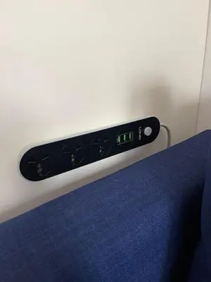a clock on the side of a bed at Well Equipped New Family Friendly One-Bedroom Flat in Sandanski