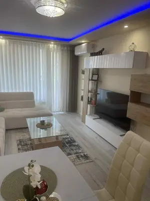 a living room with a couch and a bed at 2 Bedroom apartment in Gotse Delchev