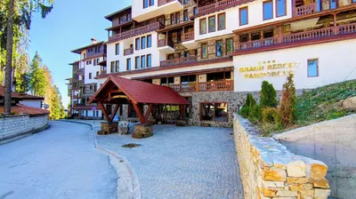 a building with a gazebo in front of it at Tulip Studio Superior, Grand Resort Pamporovo in Pamporovo